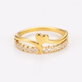 Macro shot of gold double-layer heart ring with cubic zirconia inlay and wavy band - US 6 / Gold