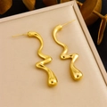 Macro detail of gold-plated irregular teardrop earrings on a beige velvet jewelry pad - Curved Drop Earrings (E6208)