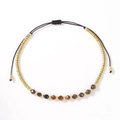 Handcrafted adjustable woven bracelet featuring golden beads and natural tiger eye stones - Brown