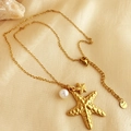 Golden stainless steel starfish necklace with pearl pendant on champagne fabric - Starfish Pearl Necklace-Gold