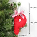 Christmas tree decoration featuring a red felt letter P with bow and bell details - P-Bell