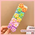 Close-up of 10 colorful elastic nylon flower hair ties for girls on a display card - Little Flower (10 Pcs)