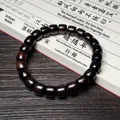Bracelet ethnique en bois de santal avec perles cylindriques et grain de bois naturel - Ébène du Mozambique 8x9mm
