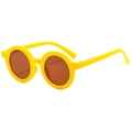 Close-up of matte yellow round frame baby sunglasses with dark brown UV400 lenses - Round / Yellow