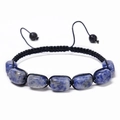 Macro shot of blue square natural stone beads on a black hand-woven adjustable bracelet - Sodalite Bracelet