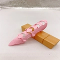 Pink plastic fingertip protector with mesh texture for sewing and manicures - Three-Section / Pink
