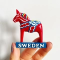 Traditional red Swedish Dala horse fridge magnet with blue Sweden base display - (84) Swedish Dala Horse