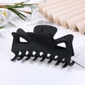 Close-up of matte black geometric hair claw clip with floral and fan props background - Matte Black / 9.5CM