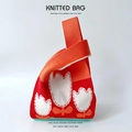 Knitted bucket bag with orange and red stripes featuring white tulip flower patterns - Orange Red Small Flowers