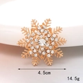 Detailed view of a gold snowflake charm with crystals showing 4.5cm size and 14.5g weight - Snowflake (Gold)