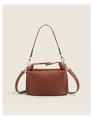 Close-up of caramel woven leather handbag with gold buckles and detachable straps - Brown