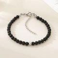 Détail d'un bracelet en perles de lave noire avec fermoir mousqueton réglable en acier - Couleur Acier Style Pierre de Lave Noire (KB207126-Z)