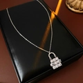 Detail of silver flower necklace with sparkling zircons in a premium jewelry box - Silver