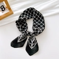 Black silk scarf with white geometric cross patterns and a stylish ethnic border detail - Windmill Zigzag Black