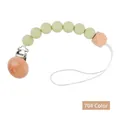 Silicone pacifier clip with beech wood beads in light green and natural finish - Style 70 Red/Green Geometric
