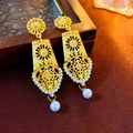 Macro shot of vintage style gold-tone earrings featuring white pearls and filigree detail - 925 Silver Earring Post / Matte Gold Pattern