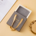 Gray drawer jewelry box with white lining and gold ribbon handle for rings and necklaces - Gray (With Logo)