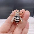 Golden bee brooch featuring white zircon crystals and black enamel stripes on body - Style 18