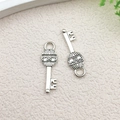 Antique silver alloy key charms for DIY jewelry making with intricate scroll patterns - Scroll Pattern Vintage Key