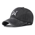 Detailed view of white butterfly embroidery on a black washed cotton baseball cap - Butterfly Black