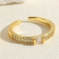 Detailed close-up of a gold-plated adjustable ring featuring a rectangular zircon - White Rectangular Zircon