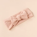 Close-up of pink baby headband with soft ribbed texture and bow design detail - Pink
