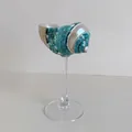 Artistic seashell wine glass with green wave patterns and a clear glass stem pedestal - Transparent Base Striped Green Turban Snail Wine Glass