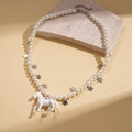 Detail of faux pearl necklace with silver star charms and iridescent white horse pendant - Pearl Horse Necklace / Necklace-White