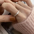 Minimalist silver twist ring with square buckle detail worn by a model on hand - Square Buckle Twisted Open Ring (J2641)