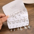 Silver earring set with heart, butterfly, and cross charms on white display card - Silver Star Moon Butterfly Stud Style (60050)