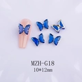 Detail view of 10x12mm blue crystal butterfly nail charms with golden metal base - Royal Blue + Gold Base