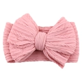 Pink nylon elastic baby headband featuring a large textured knit fabric bow on white background - Pink