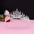 Detail of silver bridal tiara with sparkling crystal rhinestones and pointed spire design - No.9 Silver (White Stone)