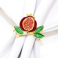 Golden pomegranate napkin ring with red enamel and rhinestones on a white napkin - 132-Pomegranate Design