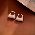 Macro shot of pink enamel trapezoid earrings with golden metal frame on brown fabric - 30# Ear Buckle-Pink Enamel Handbag Shaped Earrings