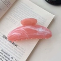Pink marble texture large hair claw clip in a half-moon design for elegant hair styling - Orange