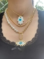 Detail of layered gold Hamsa hand and Evil Eye necklaces featuring pearls on female neck - Hamsa Hand Necklace, Pearl Chain And Gold Chain / Gold+White