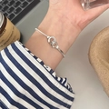 Elegant silver bracelet with interlocking rings and French lucky engraving on female wrist - Silver French Lucky Double Ring (MY35001)