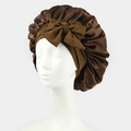 Brown satin sleep bonnet featuring a large bow and elastic band on white mannequin head - One Size / Coffee