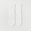 White cotton yoga socks with mid-calf height and silicone anti-slip grips on sole - One Size / White