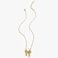 Elegant gold bow pendant necklace with beaded chain on a white background - Gold Necklace