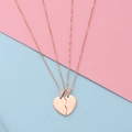 Detail of rose gold split heart pendant necklaces for couples on pastel background - Rose Gold Set