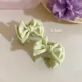 Detail of 5.3cm satin ribbon bow hair claw clips in soft green silk fabric for women - Single Piece / Green