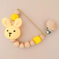 Handmade pacifier clip with yellow knitted bunny and natural beech wood beads - Yellow