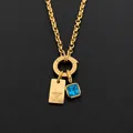 Collar de acero de titanio chapado en oro de 14K con colgante de letra Y y cristal azul - Letra Y