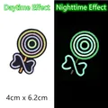 Glow-in-the-dark lollipop embroidery patch showing day and night luminous effects - Lollipop Style (GZ-05548-8) / 4cm x 6.2cm