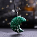 Close-up of malachite moon pendant with silver tree of life wire wrapping detail - Malachite