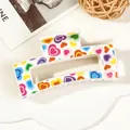 Macro shot of white acrylic hair claw clip with colorful heart patterns for hair styling - 8.5cm Heart Print - Style E White Base