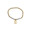 Detail view of a gold bead bracelet with white pearls and square Q letter pendant charm - Letter Q