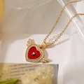 Golden winged necklace with red enamel heart pendant and sparkling zircon accents - Heart with Double Wings / Gold